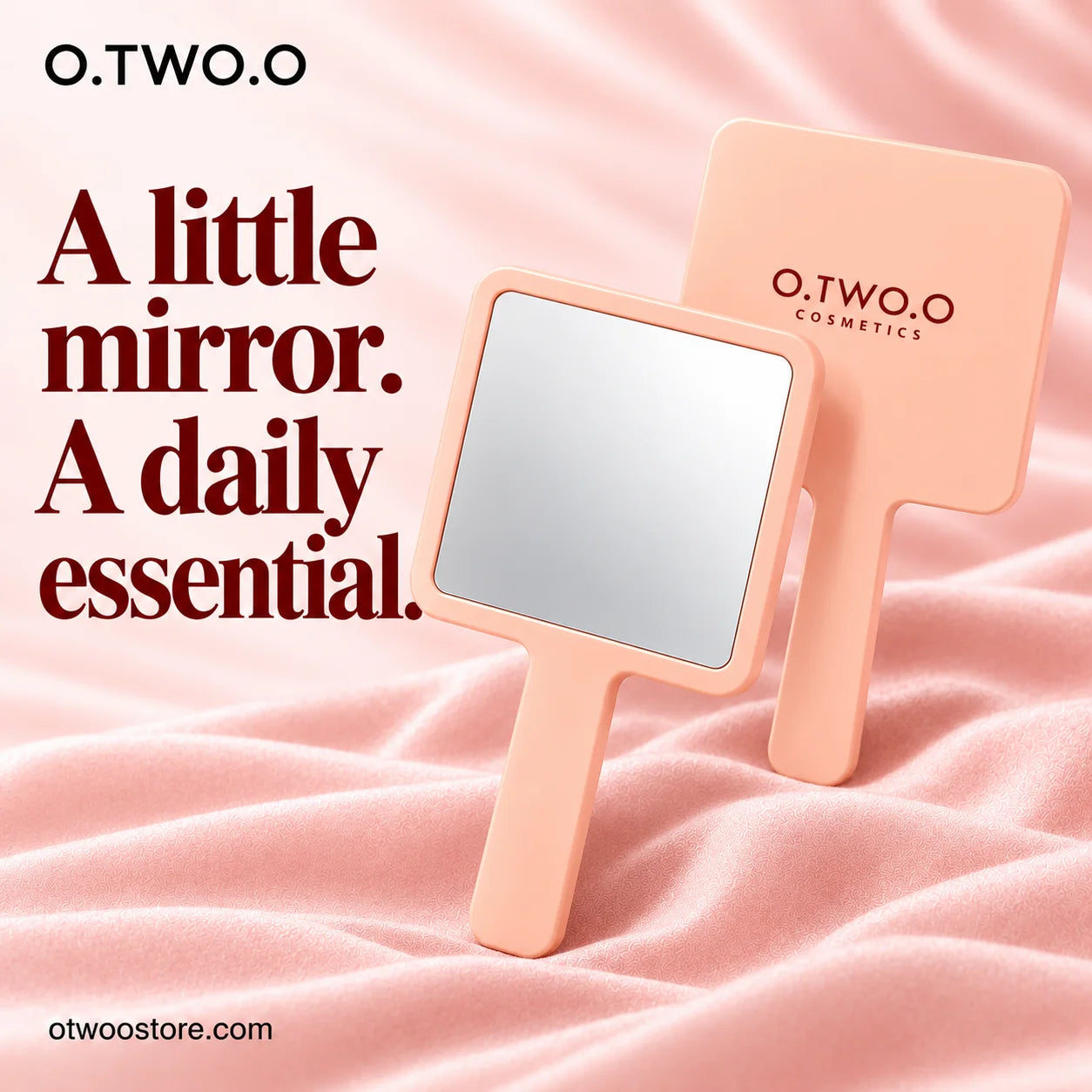 Peach handheld makeup mirror showing front and branded back on blush satin