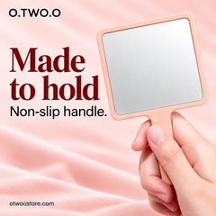 Peach makeup mirror held securely by its comfortable non-slip handle